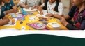 Children at table assembling craft project