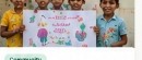 Children proudly displaying community artwork
